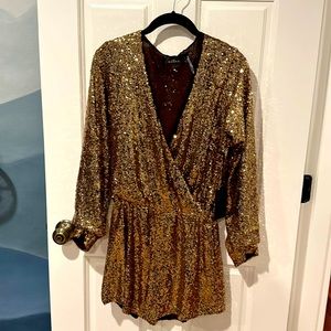 Brand new. Small sequined romper, shorts, long sleeves